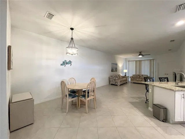 a view of a livingroom with wooden floor and window