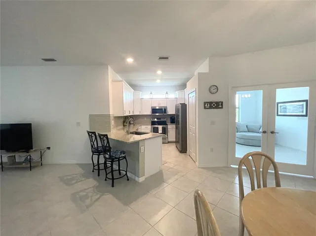 a bathroom with a shower and a sink