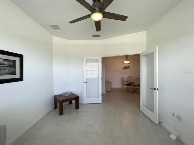 a bathroom with a granite countertop sink mirror and shower