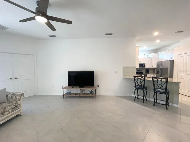 a view of bathroom with a toilet sink and mirror