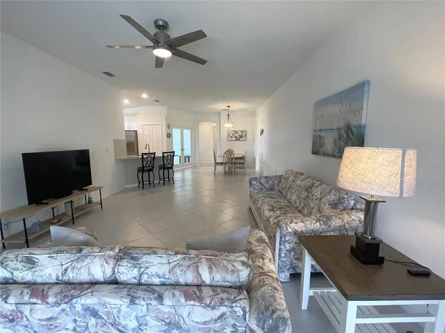 a bathroom with a granite countertop sink mirror and shower