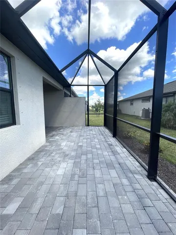 a view of a balcony with wooden floor