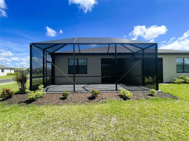 a view of a house and a yard