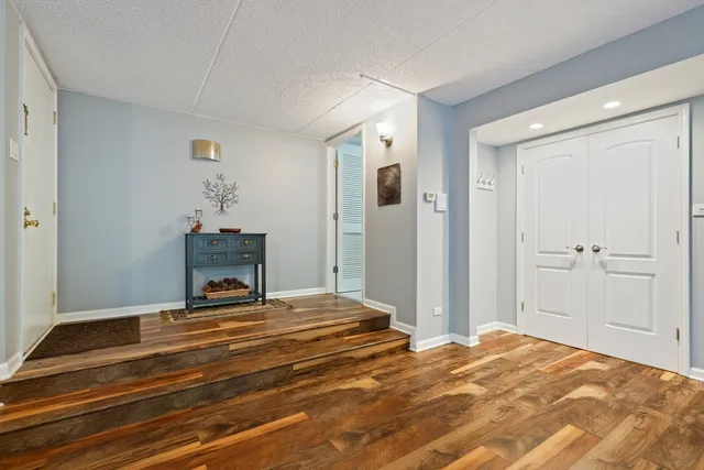 a bedroom with a bed and a table