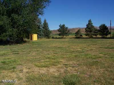 50 Forney Road Cowiche, WA 98947 - Photo 19 of 21 a view of a yard with an trees