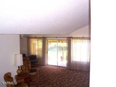 50 Forney Road Cowiche, WA 98947 - Photo 4 of 21 a living room with furniture and a floor to ceiling window
