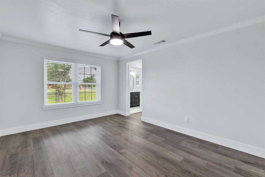 11345 Jennifer Circle Sanger, TX 76266 - Photo 31 of 39 a view of an empty room with wooden floor and a window