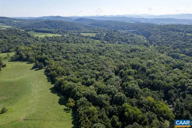a view of a lake with a yard