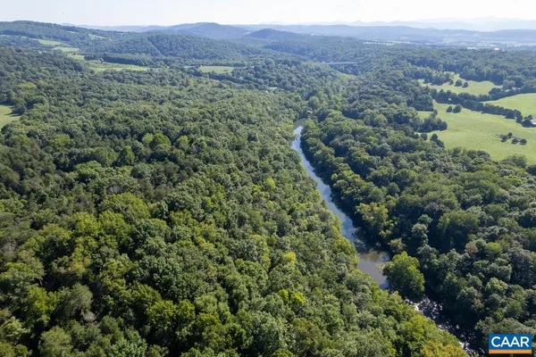a view of lake with green space