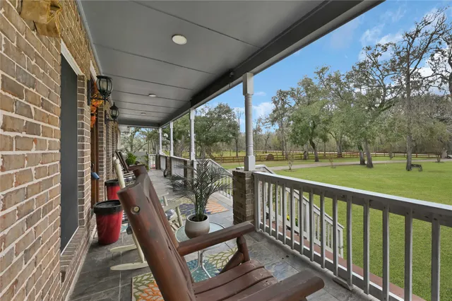 a view of a two chairs in the balcony