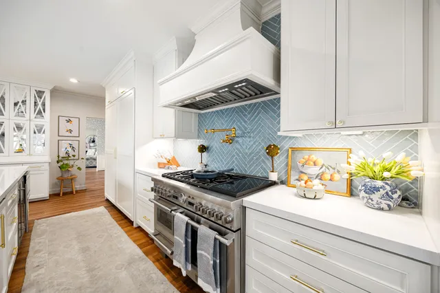 a kitchen with a stove and cabinets