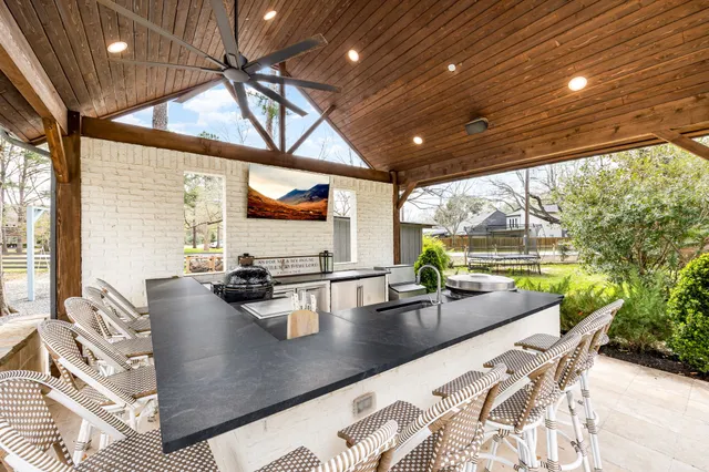 a view of a living room and kitchen with a large window