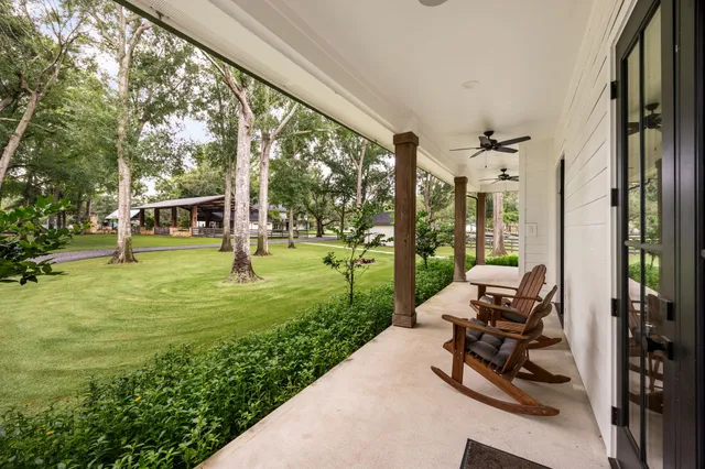 a view of a patio with chairs and a yard