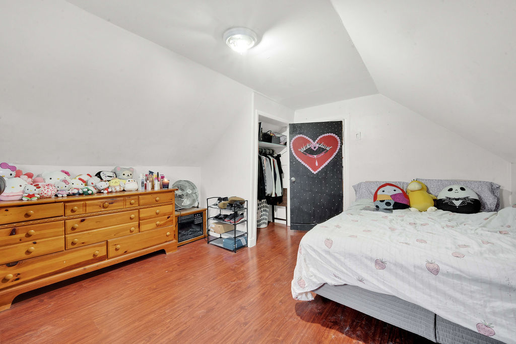 7234 South Ridgeway Avenue Chicago, IL 60629 - Photo 11 of 27 a bedroom with a bed and a dresser