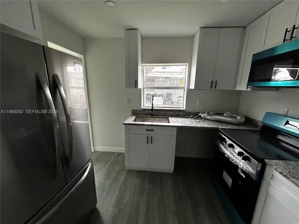 a view of an empty room with a window