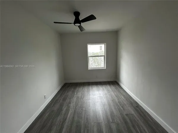 a view of a bathroom from a hallway