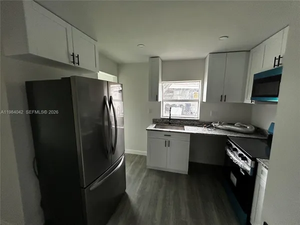 a view of a back yard of the house