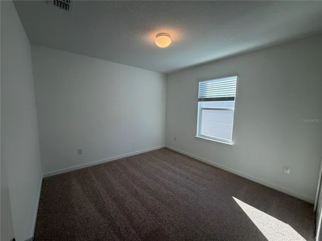 a bathroom with a tub sink toilet and a mirror