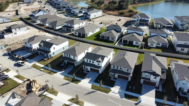 an aerial view of a house with outdoor space