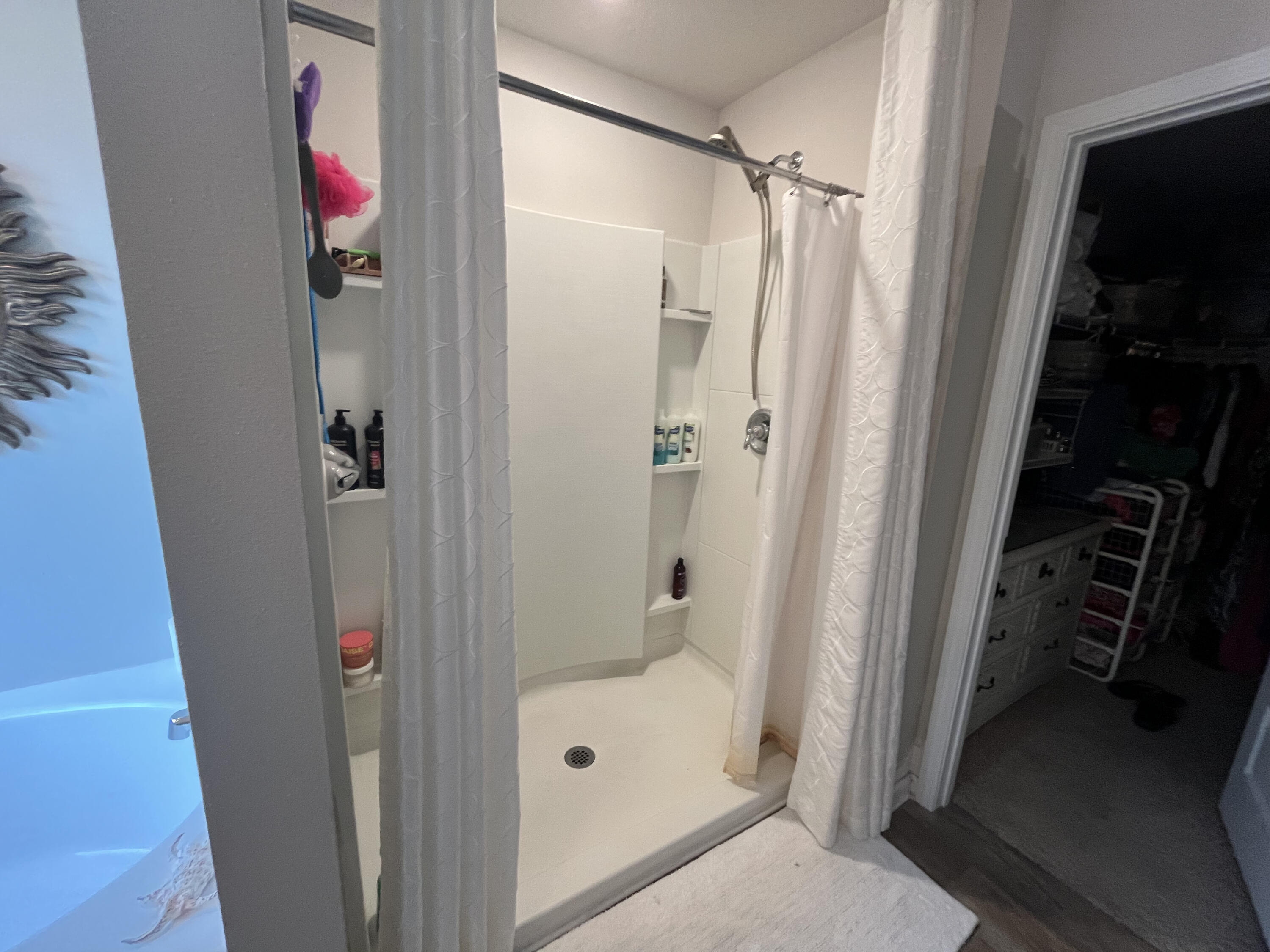 203 This Way Freeport, FL 32439 - Photo 16 of 29 a bathroom with a shower and a glass door