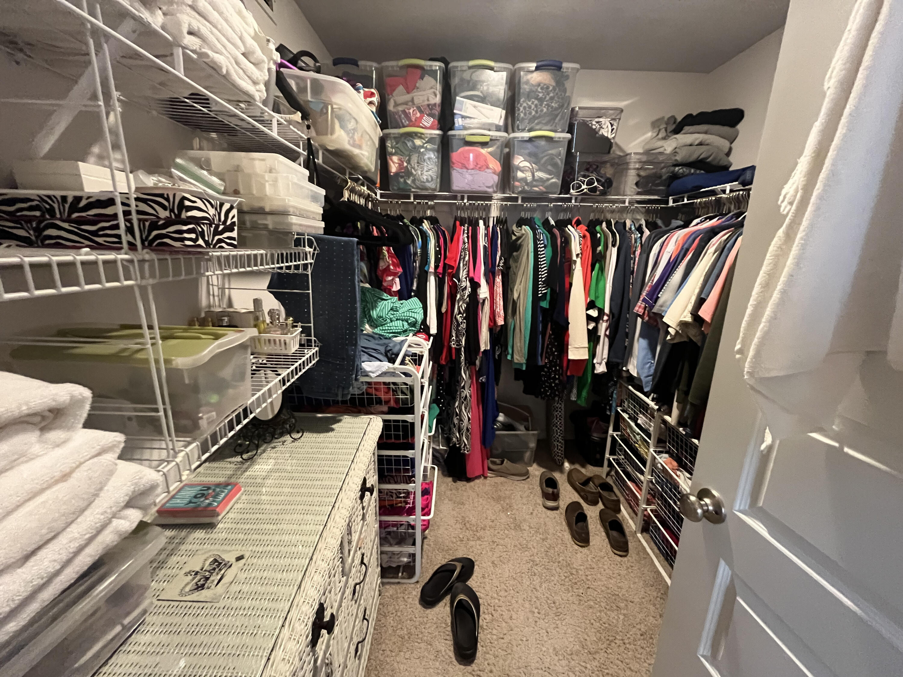 203 This Way Freeport, FL 32439 - Photo 18 of 29 a view of walk in closet with clothes and shoes