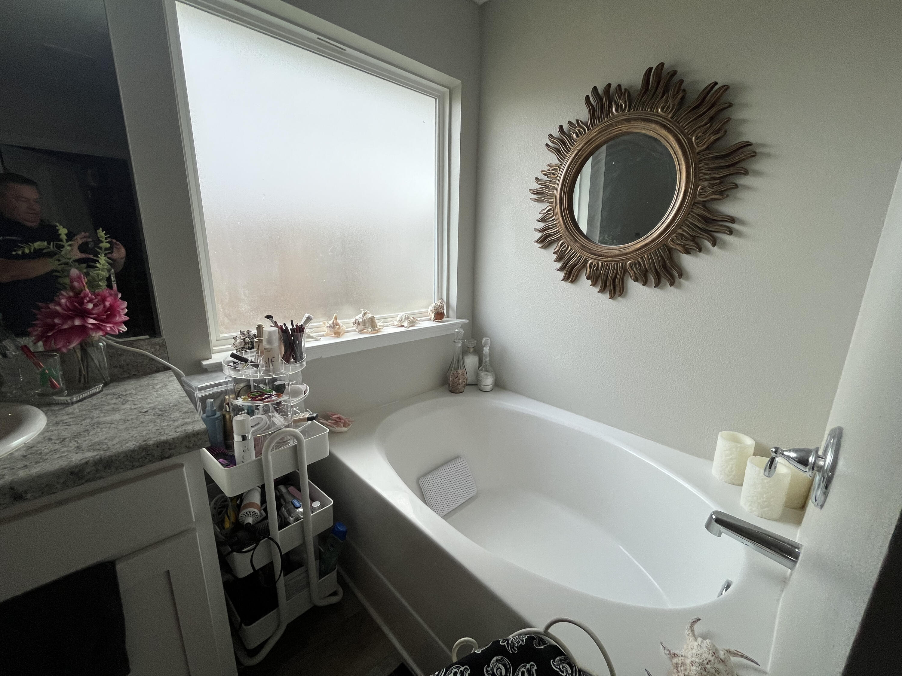 203 This Way Freeport, FL 32439 - Photo 19 of 29 a bathroom with a sink and a mirror