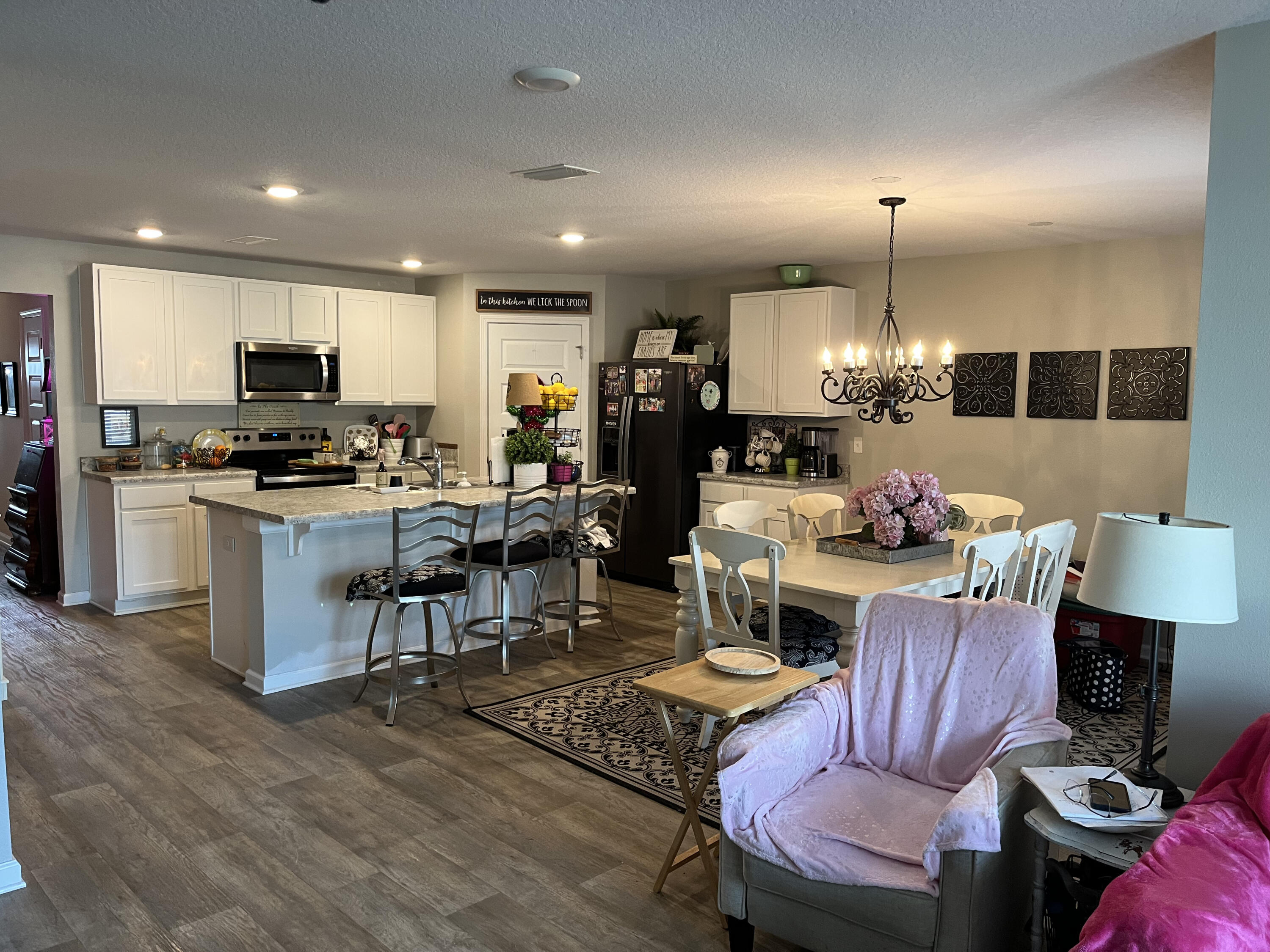 203 This Way Freeport, FL 32439 - Photo 25 of 29 a kitchen with sink a stove and chairs