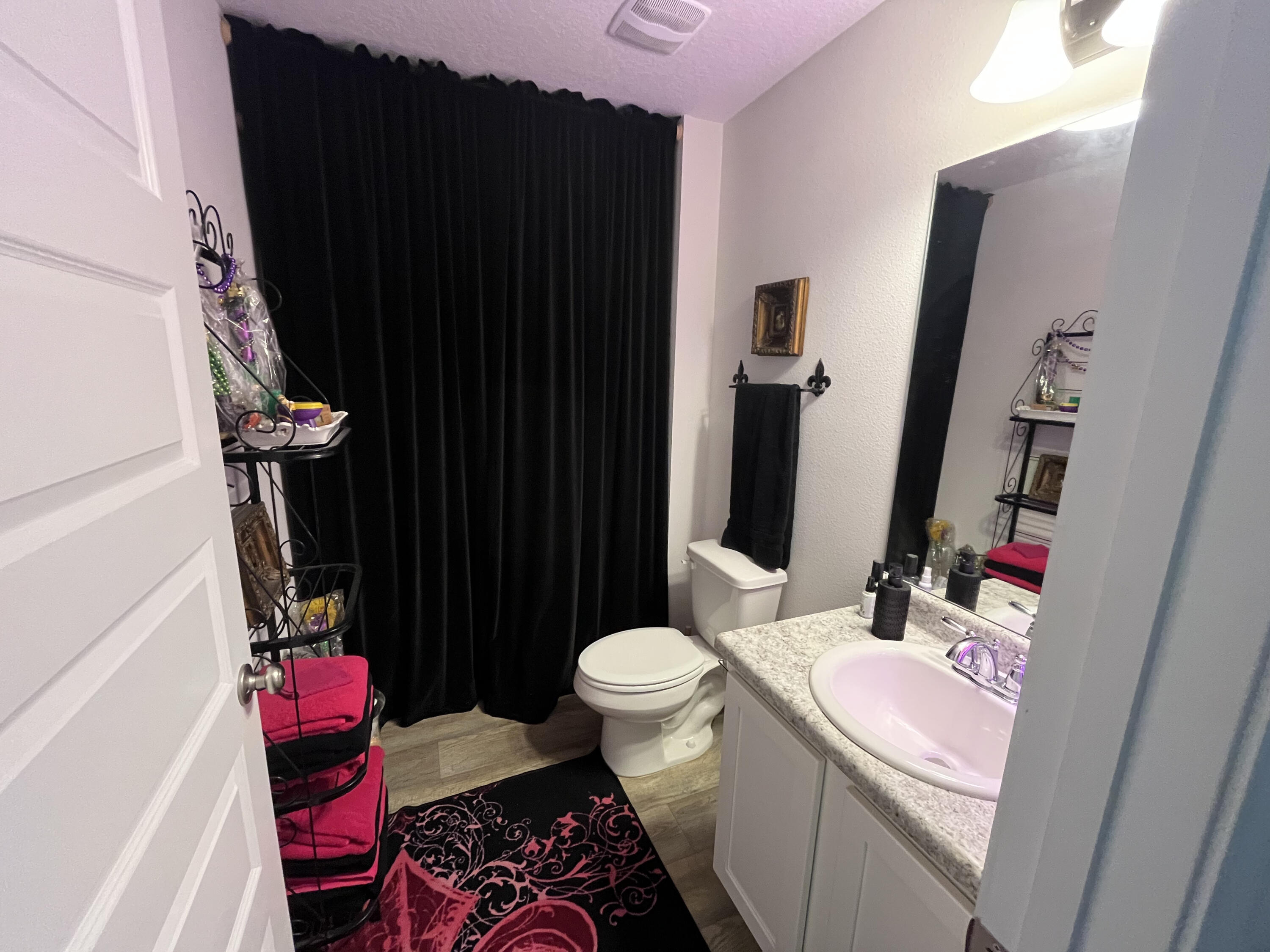 203 This Way Freeport, FL 32439 - Photo 7 of 29 a bathroom with a sink toilet and shower