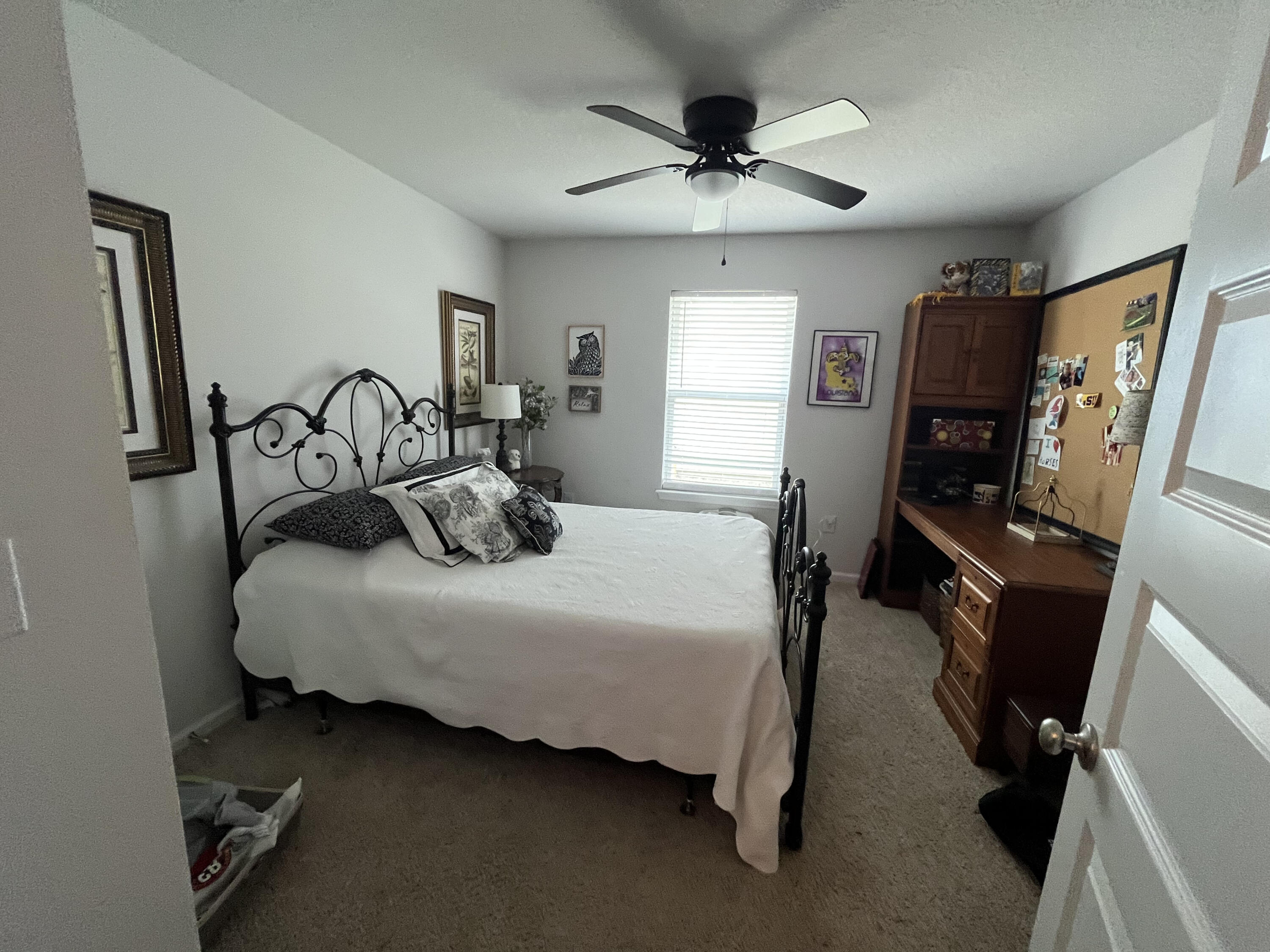 203 This Way Freeport, FL 32439 - Photo 10 of 29 a bedroom with bed and window