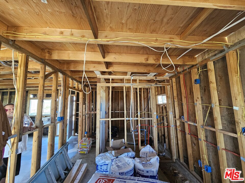 7797 Quartz Road Mojave, CA 93501 - Photo 21 of 49 a view of an empty room with wooden floor