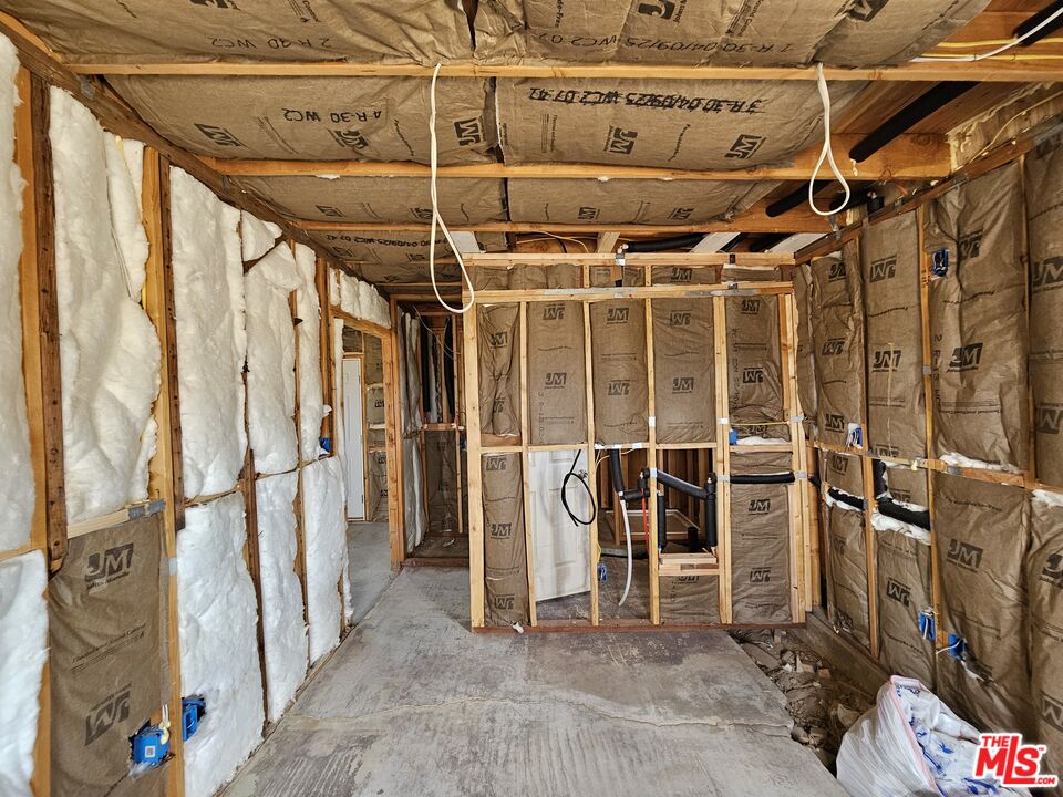 7797 Quartz Road Mojave, CA 93501 - Photo 39 of 49 a view of an empty room with wooden walls