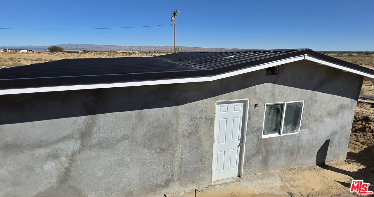 7797 Quartz Road Mojave, CA 93501 - Photo 4 of 49 a view of outdoor space with an entryway