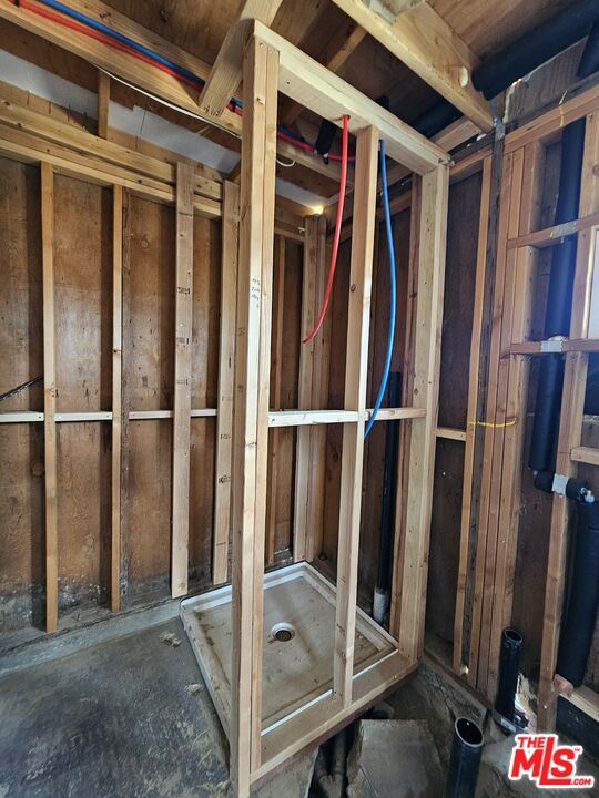 7797 Quartz Road Mojave, CA 93501 - Photo 44 of 49 a view of walk in closet with wooden floor and stairs