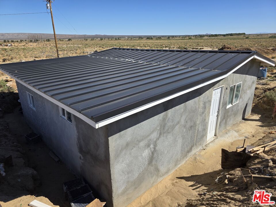 7797 Quartz Road Mojave, CA 93501 - Photo 5 of 49 a view of outdoor space with wooden floor