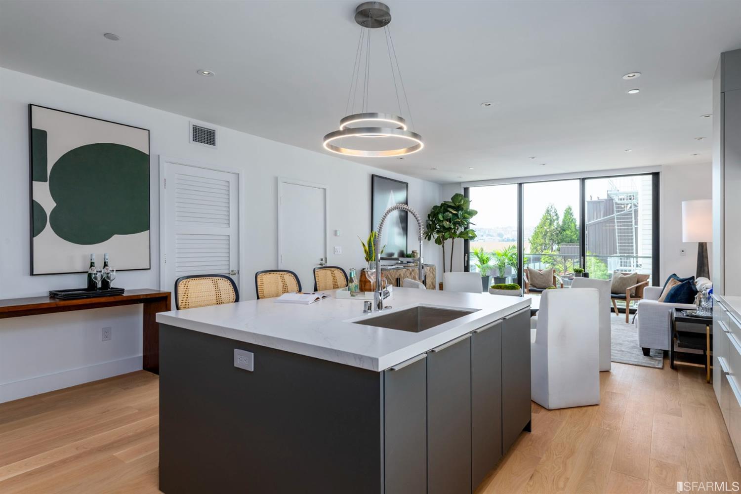 1805 Buchanan Street, Unit 3B San Francisco, CA 94115 - Photo 12 of 55 a kitchen with a sink cabinets and wooden floor