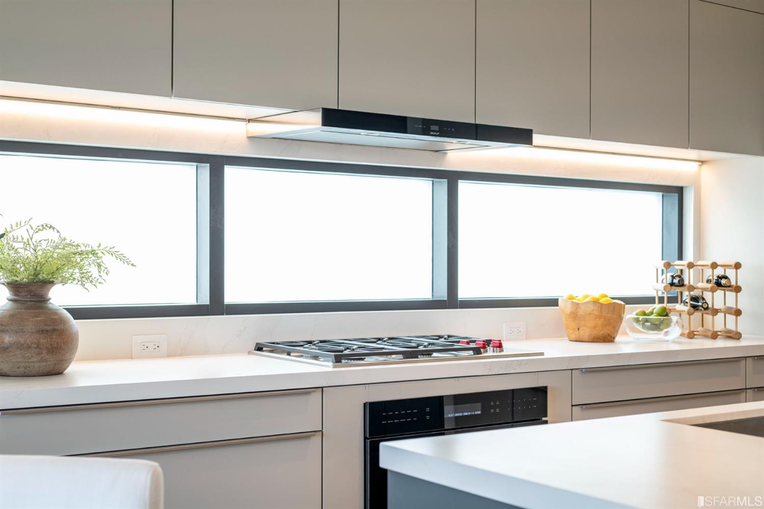 1805 Buchanan Street, Unit 3B San Francisco, CA 94115 - Photo 16 of 55 a kitchen with a stove and a window