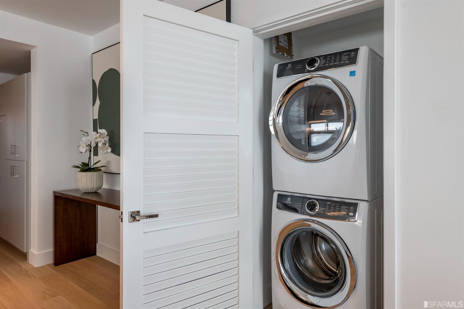 1805 Buchanan Street, Unit 3B San Francisco, CA 94115 - Photo 26 of 55 a view of a hallway with washer and dryer