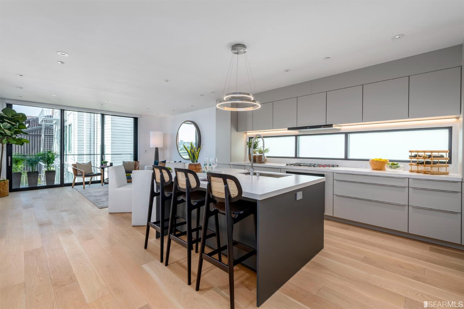 1805 Buchanan Street, Unit 3B San Francisco, CA 94115 - Photo 5 of 55 a kitchen with a table chairs stove and cabinets