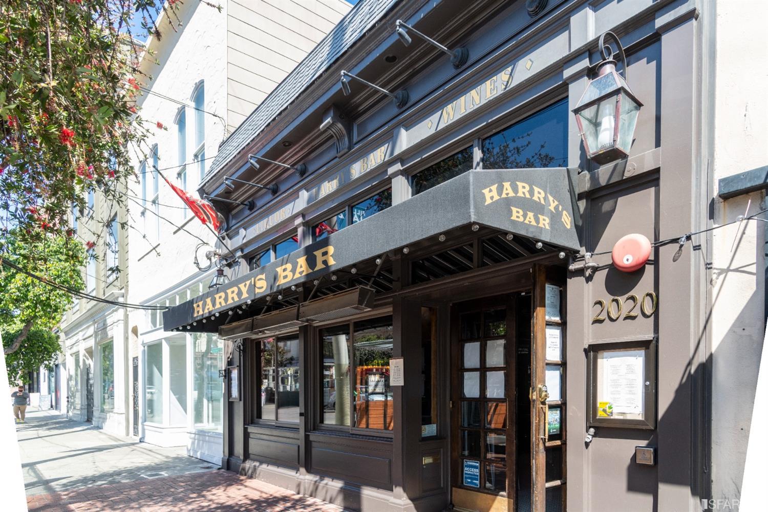 1805 Buchanan Street, Unit 3B San Francisco, CA 94115 - Photo 53 of 55 a view of a building with retail shops and traffic signal