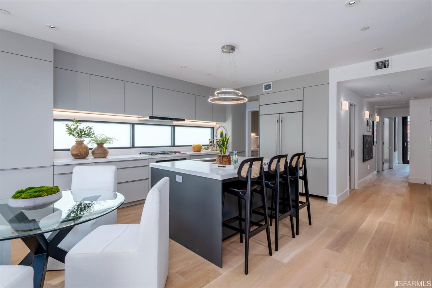 1805 Buchanan Street, Unit 3B San Francisco, CA 94115 - Photo 7 of 55 a dining hall with stainless steel appliances kitchen island granite countertop furniture and a kitchen view