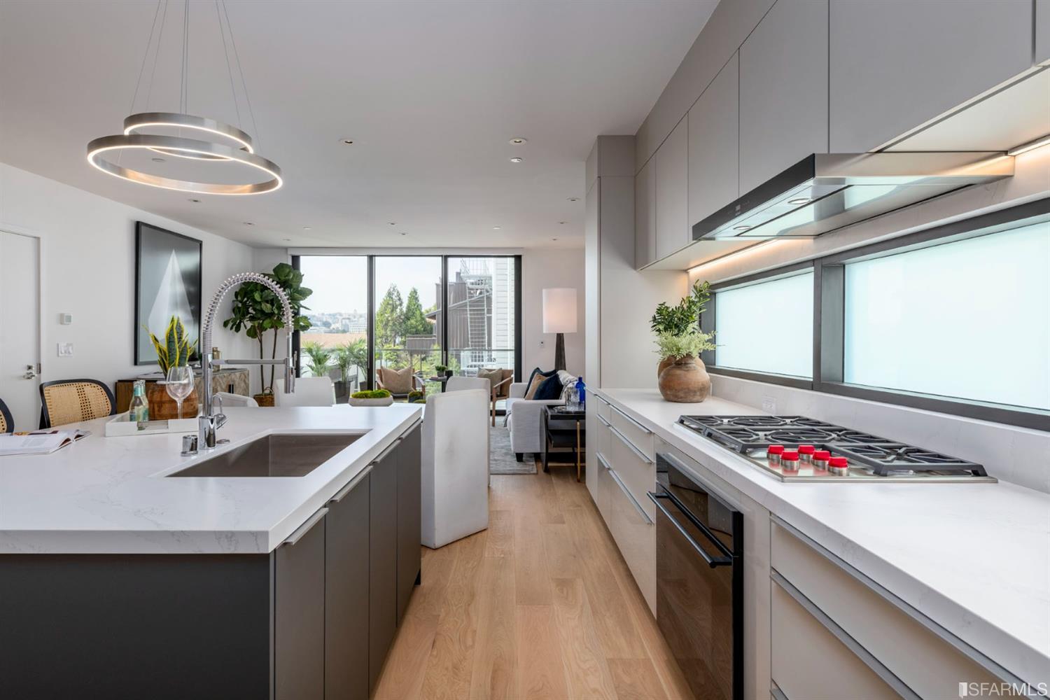 1805 Buchanan Street, Unit 3B San Francisco, CA 94115 - Photo 8 of 55 a kitchen with stainless steel appliances granite countertop a sink and a stove