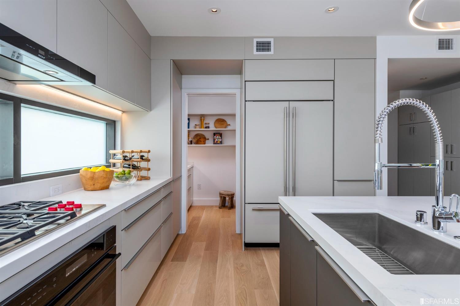 1805 Buchanan Street, Unit 3B San Francisco, CA 94115 - Photo 9 of 55 a kitchen with a sink stove and refrigerator