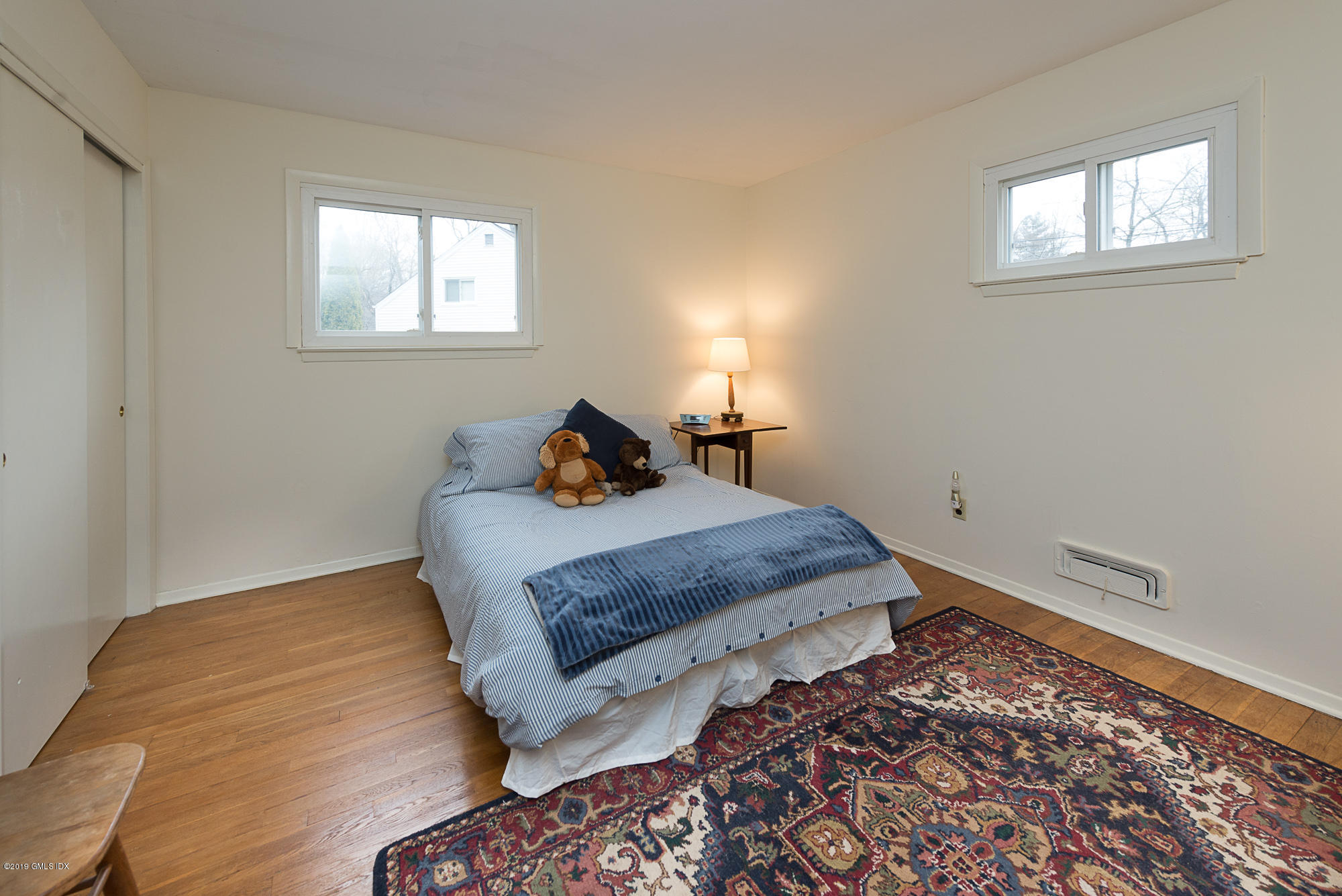 81 Mary Lane Riverside, CT 06878 - Photo 11 of 26 a bedroom with bed and window