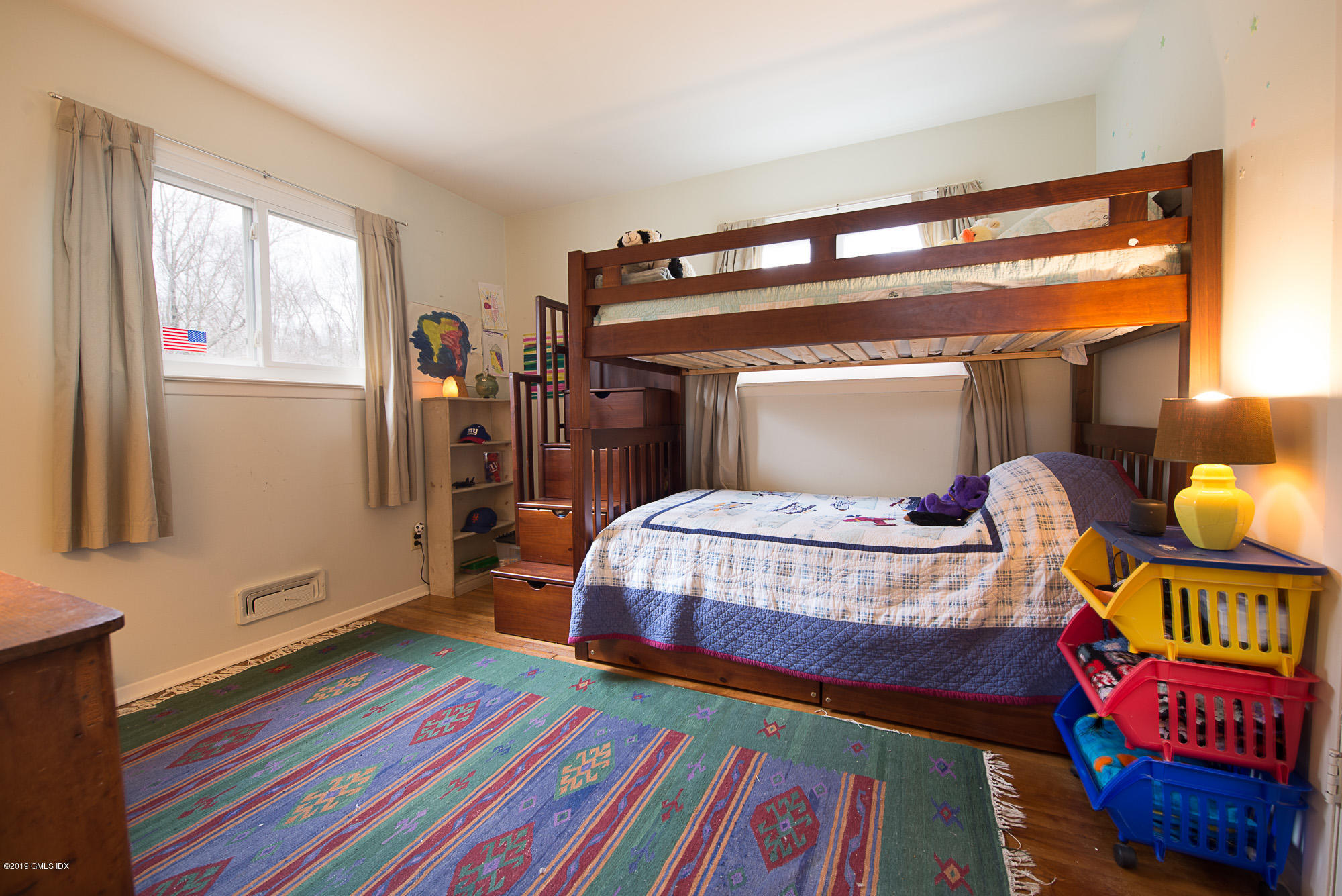 81 Mary Lane Riverside, CT 06878 - Photo 12 of 26 a bedroom with a bed and window