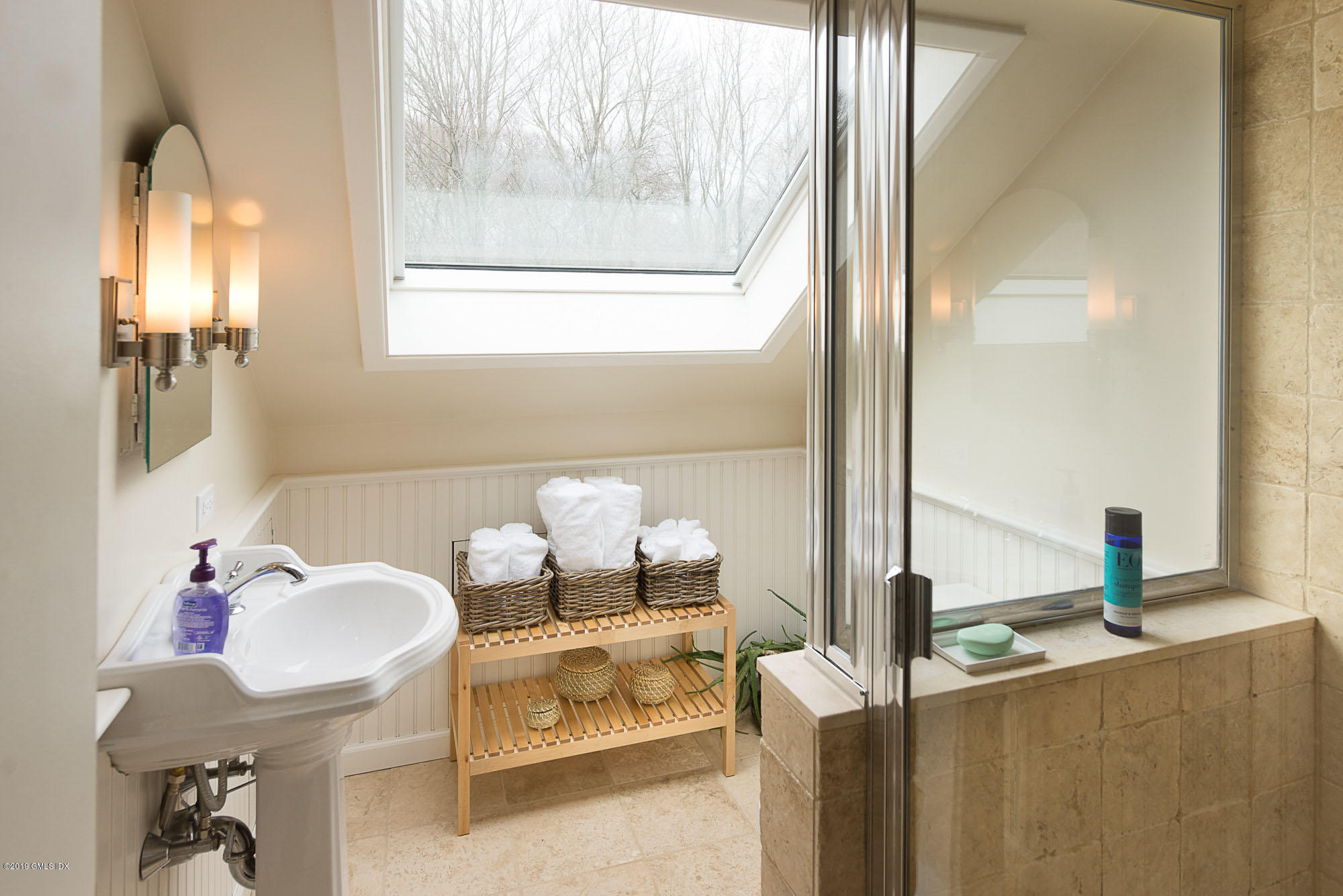 81 Mary Lane Riverside, CT 06878 - Photo 16 of 26 a bathroom with a mirror and a sink