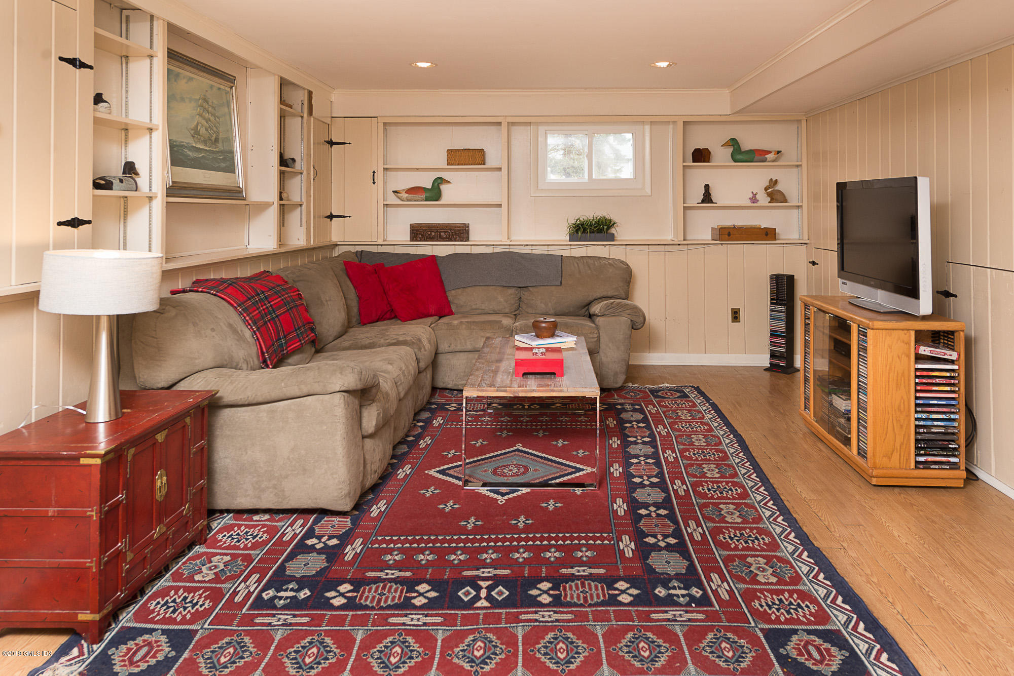81 Mary Lane Riverside, CT 06878 - Photo 17 of 26 a living room with furniture and a flat screen tv