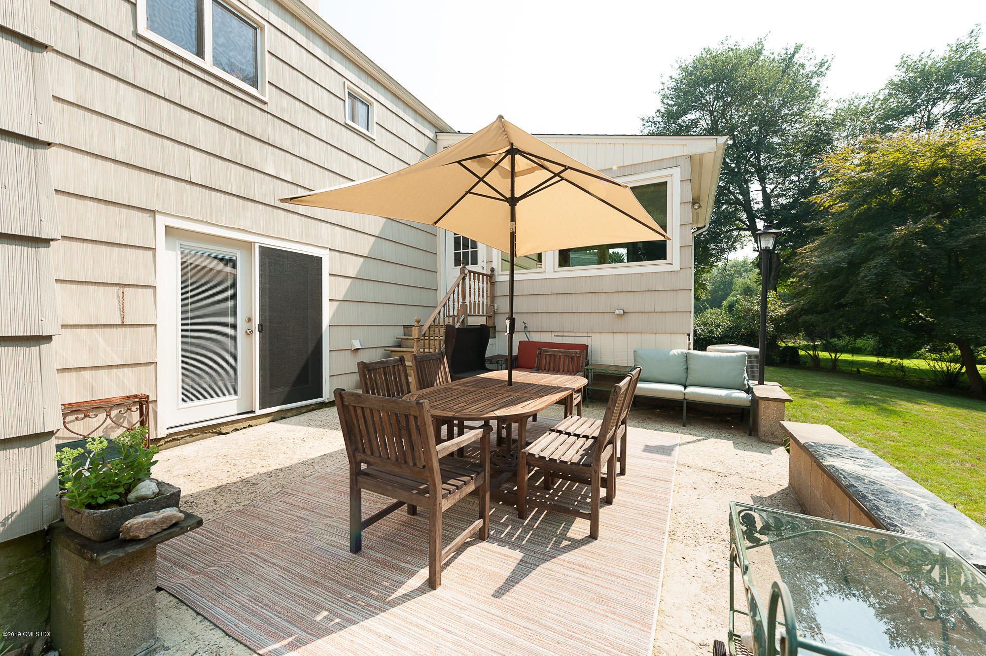 81 Mary Lane Riverside, CT 06878 - Photo 19 of 26 a view of a house with backyard and sitting area