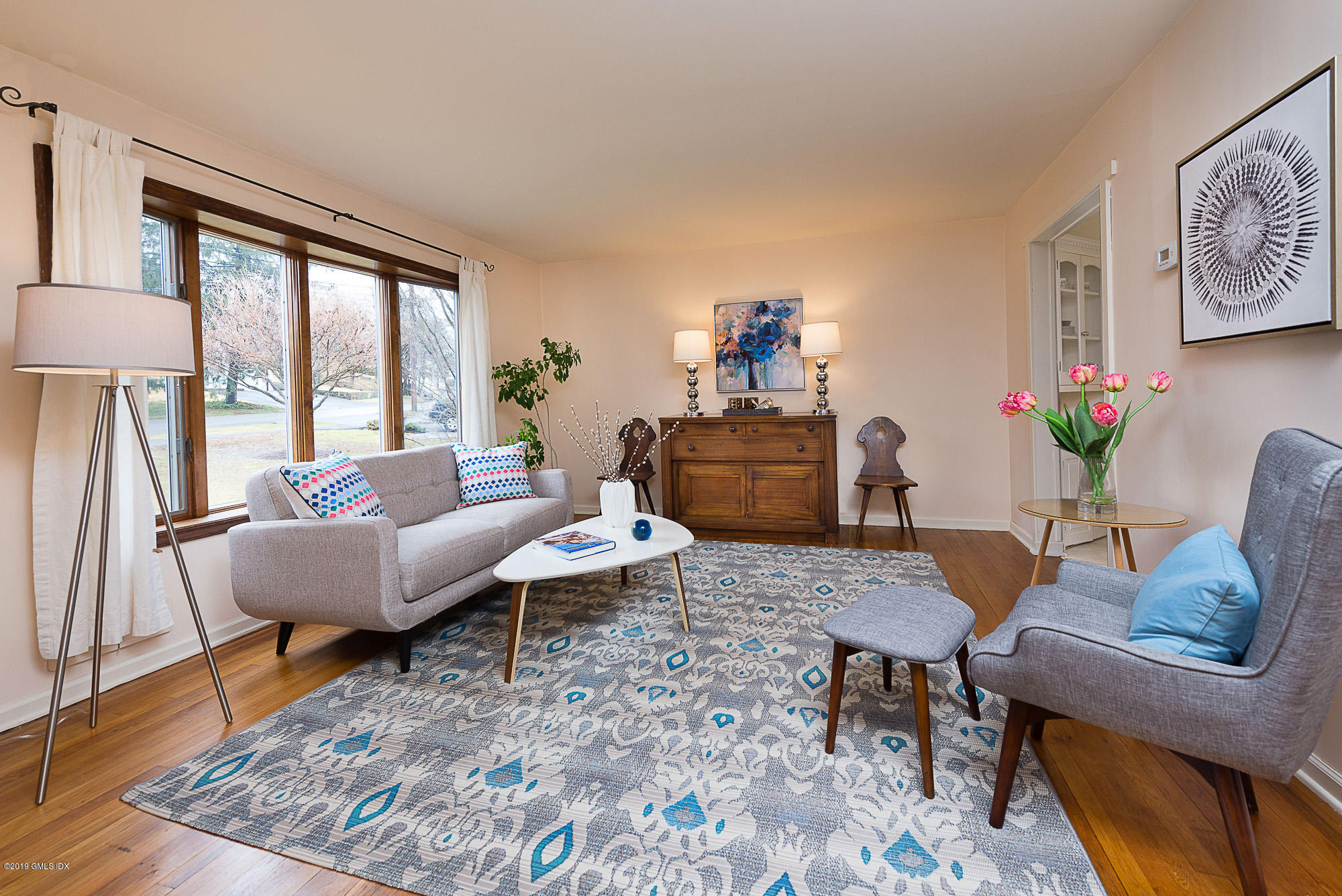 81 Mary Lane Riverside, CT 06878 - Photo 3 of 26 a living room with furniture and a floor to ceiling window