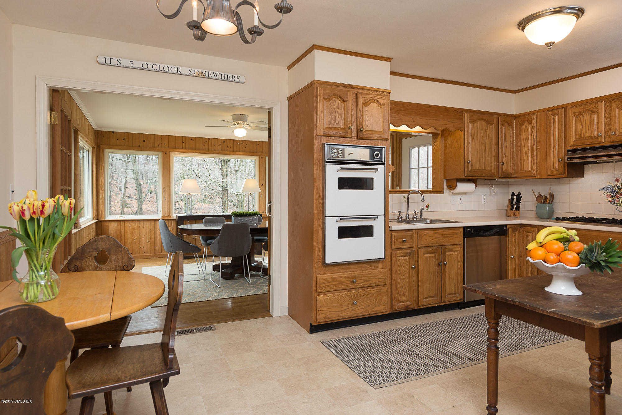 81 Mary Lane Riverside, CT 06878 - Photo 7 of 26 a kitchen with furniture a counter top space appliances and cabinets