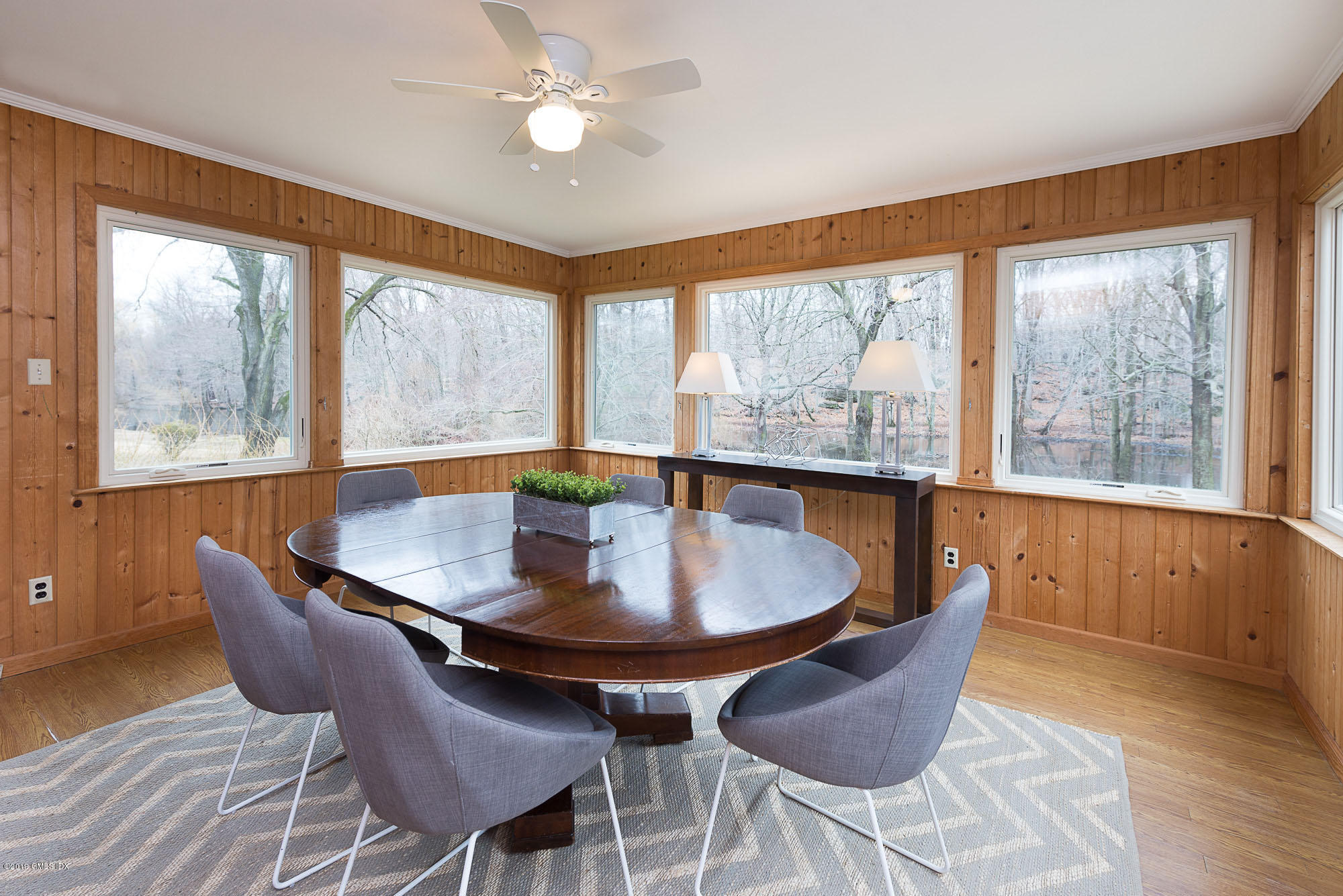 81 Mary Lane Riverside, CT 06878 - Photo 8 of 26 a dining room with furniture a chandelier and wooden floor
